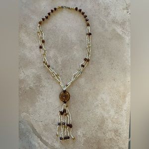 Necklace with amber, shells and beads